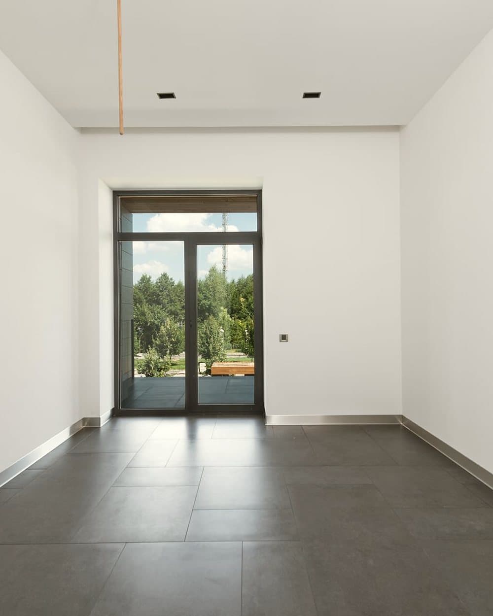 Empty builder floor in Safdarjung Enclave with full height glazing